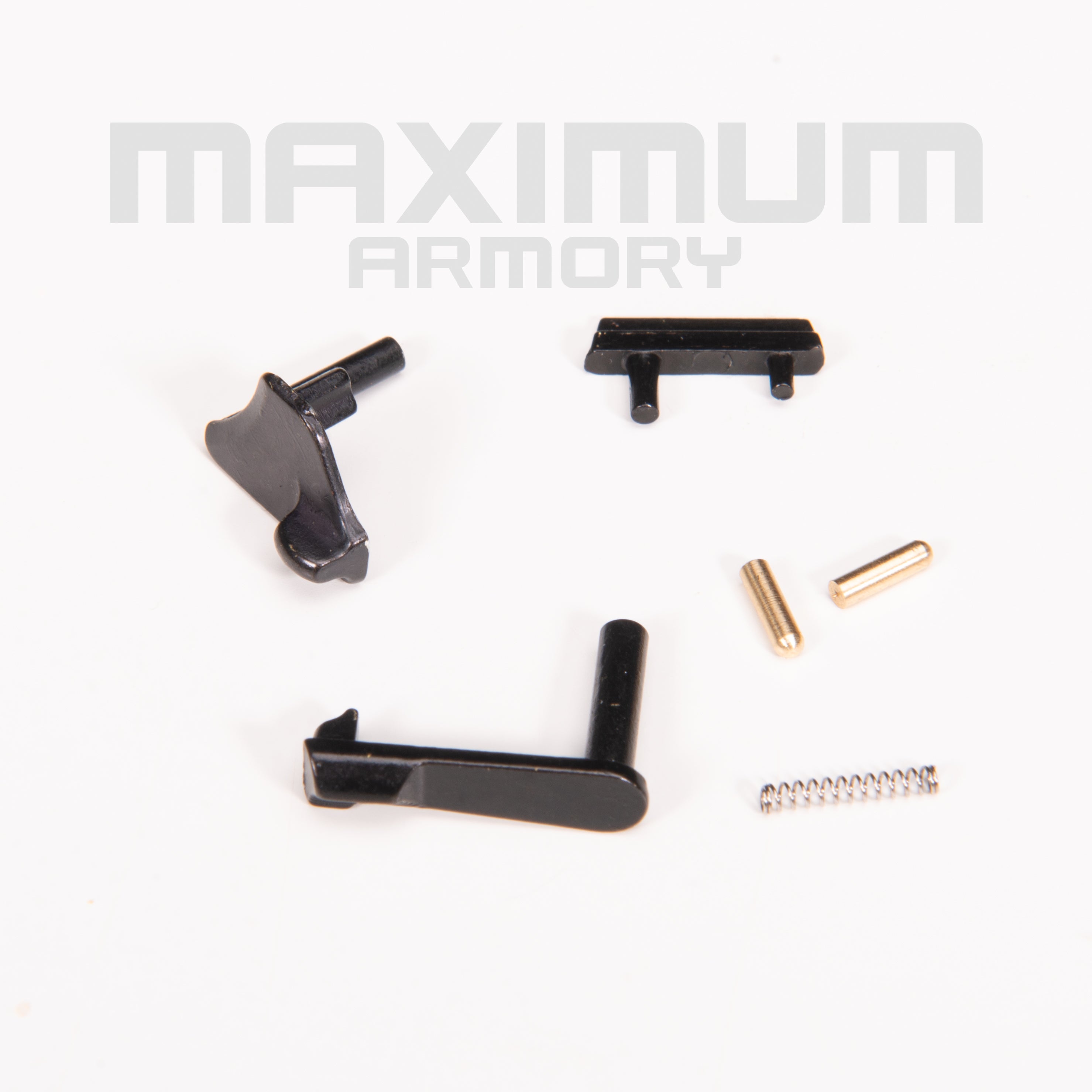 Top view of the M1911 1:2.05 Black/White 6-Piece Safety & Slide Control Parts Kit, including Slide Stop, Thumb Safety, Safety Catch Plunger, Slide Stop Plunger, and other key components for enhanced control.
