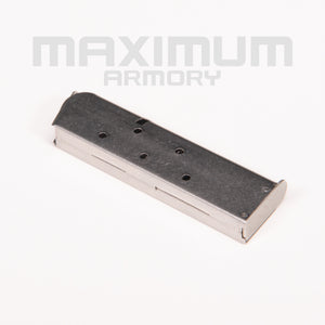 Side view of the M1911 1:2.05 Black/White Toy Guns Magazine, highlighting its realistic details, smooth finish, and robust construction for an enhanced toy gun experience.