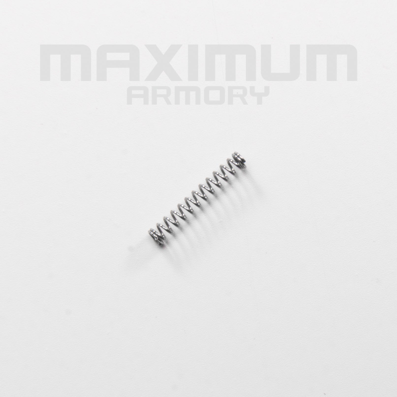 Top view of the M1911 1:2.05 Black/White Toy Guns Plunger Spring, designed for smooth safety mechanism operation and consistent tension in realistic toy gun models.